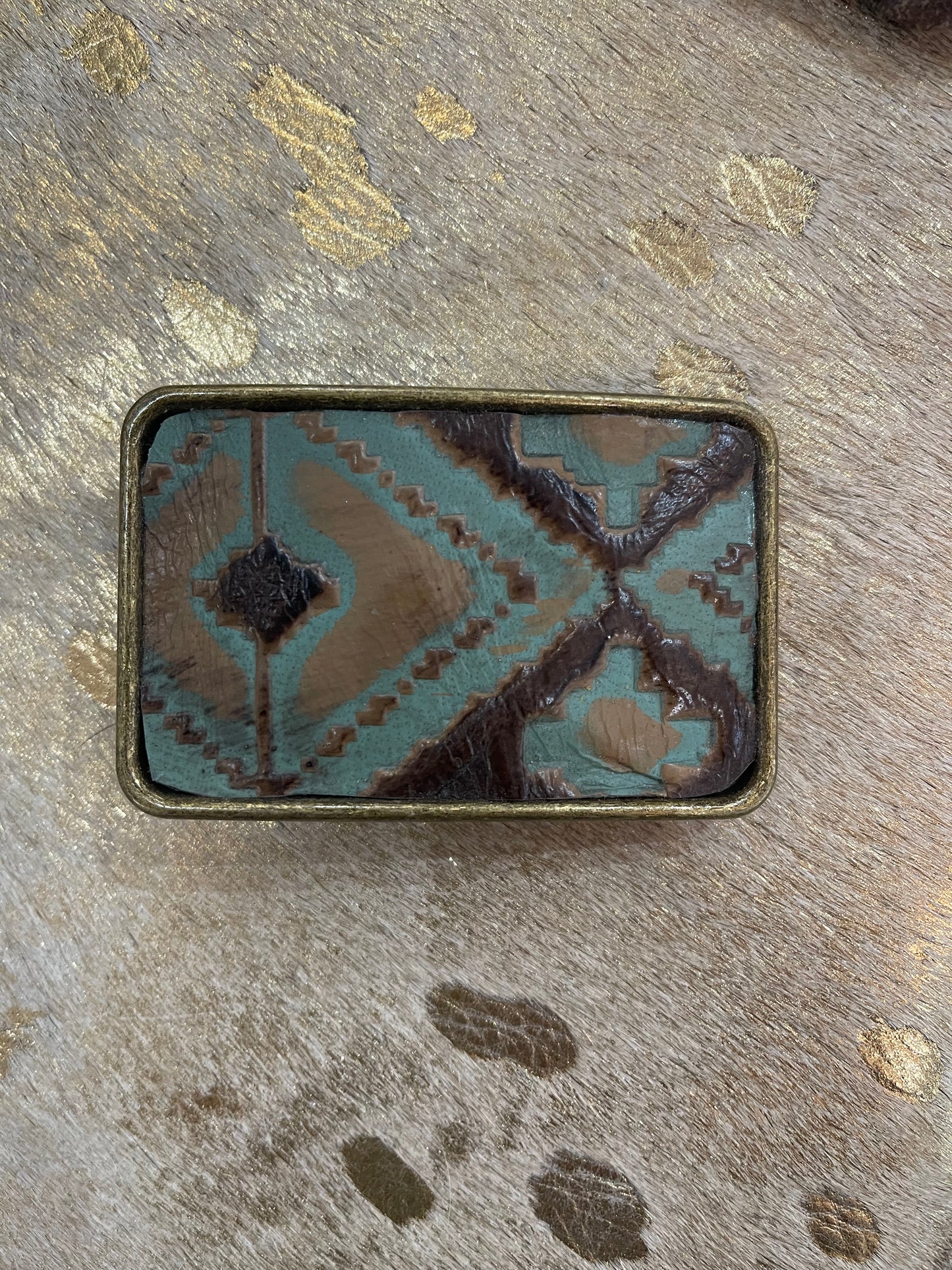 Brown and turquoise belt buckle