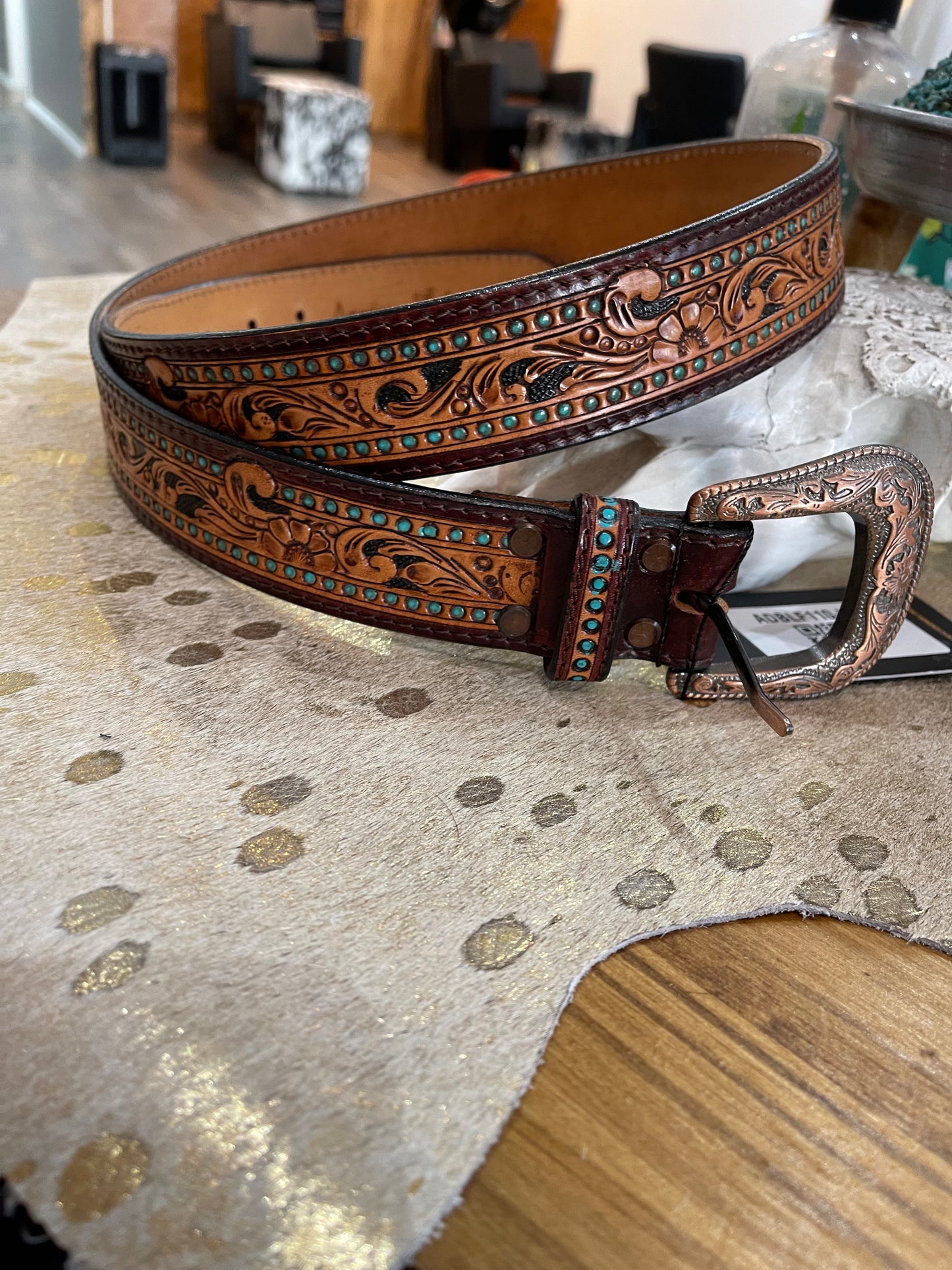 Tooled leather belt with turquoise accents