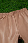 TAN FAUX LEATHER DOUBLE LAYER BELL PANTS.  SMALL